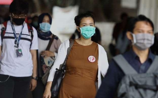 Masyarakat yang sedang menggunakan masker di masa Pandemi Covid 19 (Foto: Ilustrasi)